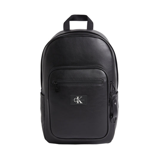 Calvin Klein Jeans mens black tagged rounded backpack | Vilbury London